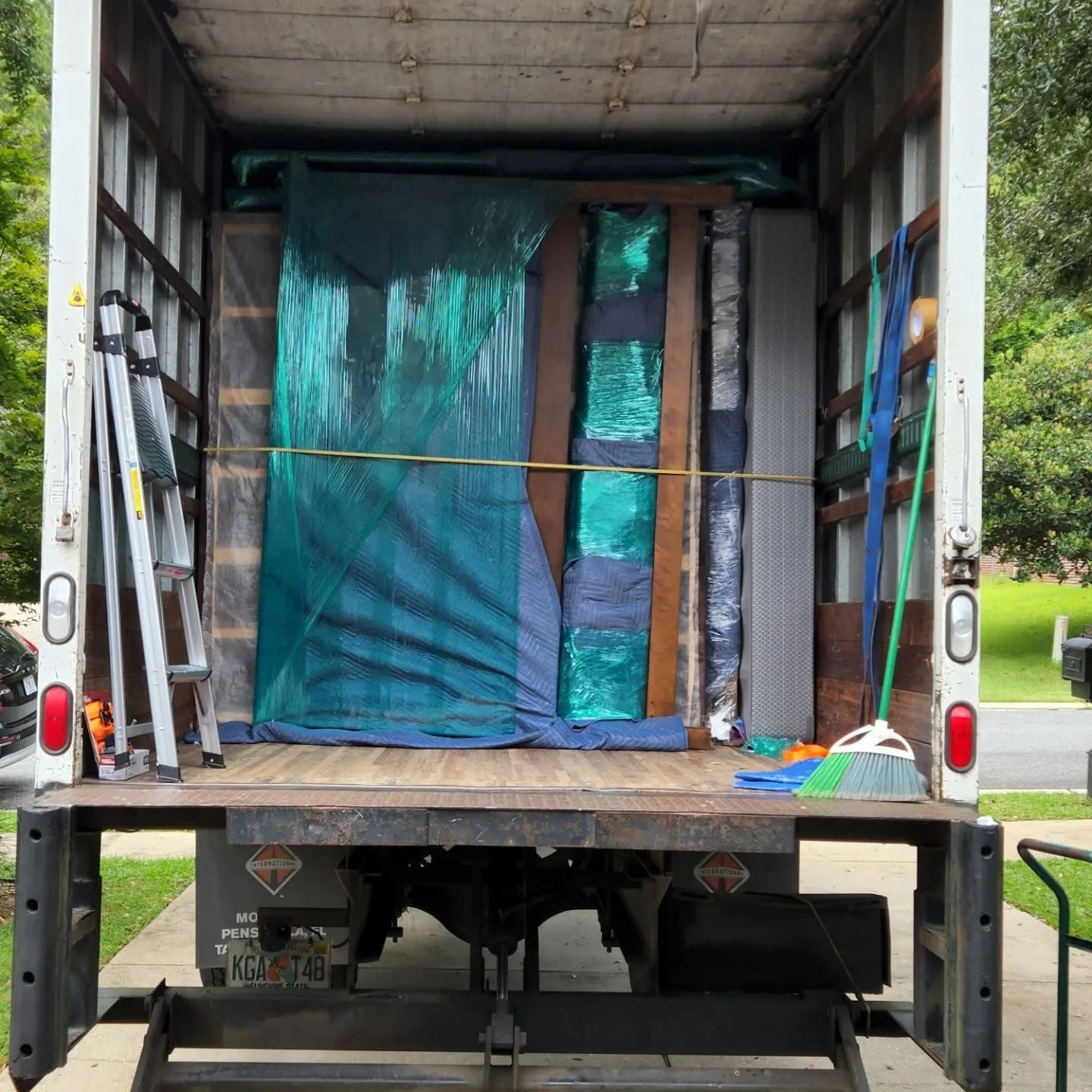 Furniture wrapped in moving blankets and shrink wrap, strapped securely inside a Master Movers of Tallahassee truck Furniture wrapped in moving blankets and shrink wrap, strapped securely inside a Master Movers of Tallahassee truck